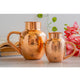 Stylish pure copper jug in hammered surai design with bowl lid perfect for daily hydration and festive Indian decor use