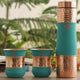 This copper bottle with 2 glass set in hammered gray design is something you will love using every day at home or work