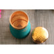 Indian Art Villa copper bottle with hammered surface and silk green tone used for daily hydration in luxury bedroom settings