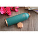 Soft green copper water bottle with a steady base and round top designed to look neat and elegant by Indian Art Villa