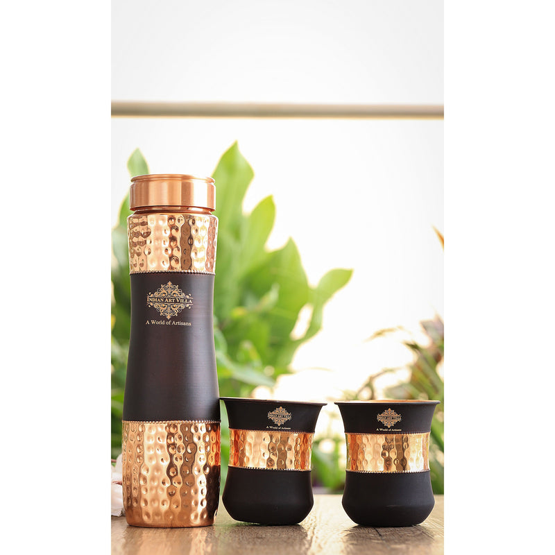 Exquisite copper drinkware set by Indian Art Villa with a hammered texture and black silk finish, perfect for gifting.