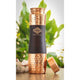 Matte black and hammered copper bottle set with two copper glasses featuring modern rounded design.